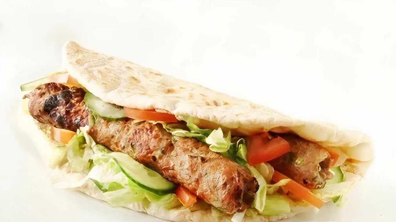 Lamb Kabab Wrap at Friends Donair & Shawarma Winnipeg — seasoned lamb kabab in a grilled wrap